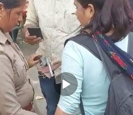 The girl was roaming in the market with a gun