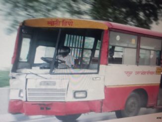 driver driving a bus wearing a helmet